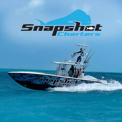 An image of a boat named "Snapshot Charters" speeding on the ocean with the company logo featuring a fish above the text in the sky.